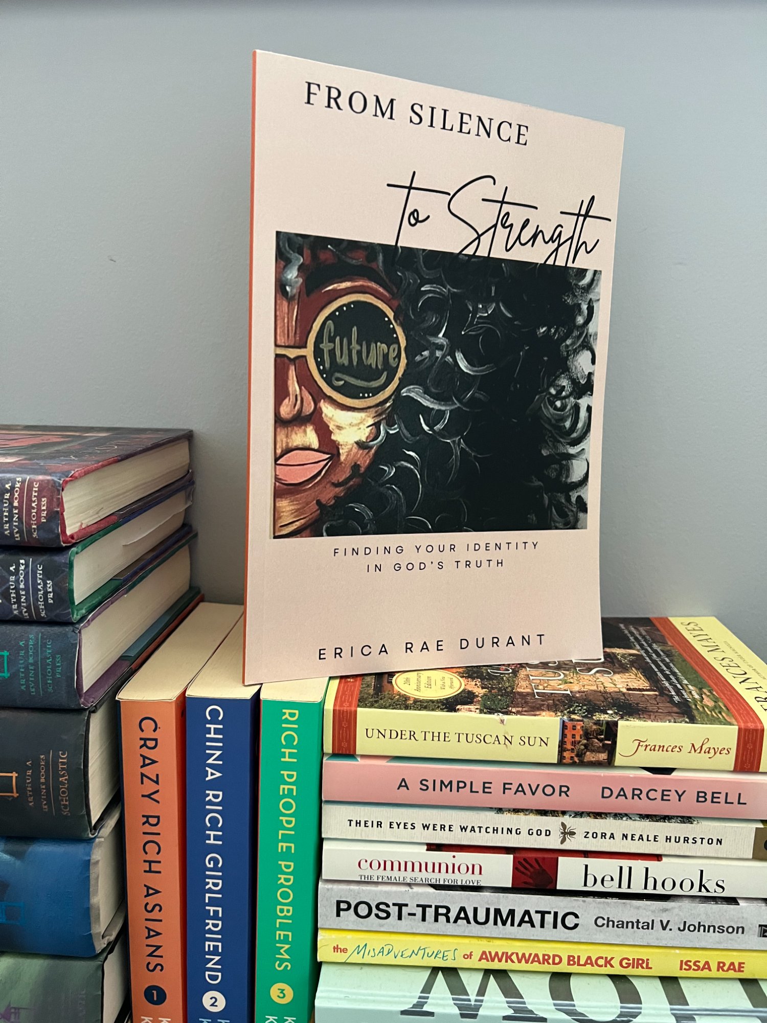 From Silence to Strength on a stack of books